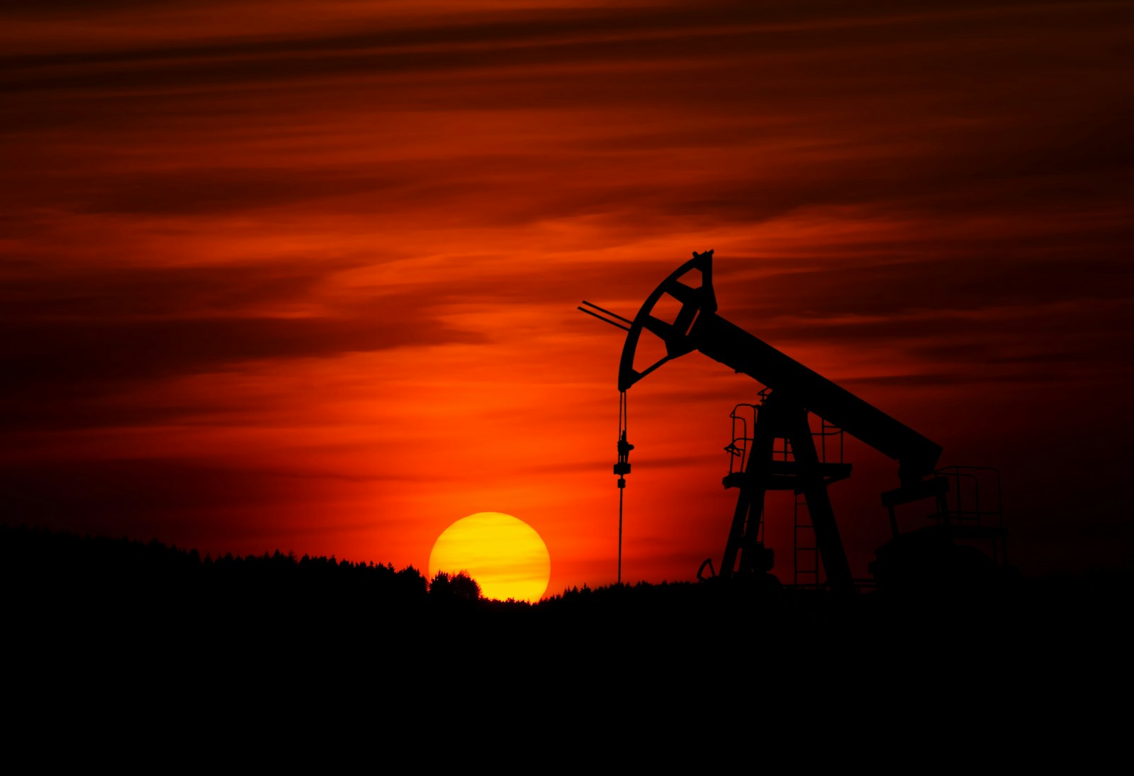 Oil pumpjack at sunset